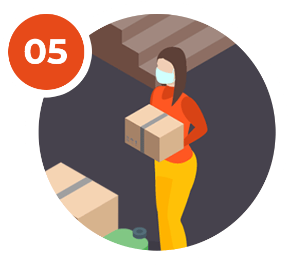 Tip 05: A masked woman carries a moving box beside packed boxes.