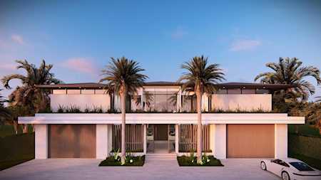 Modern flat-roofed home with a long glass-fronted façade, palm trees, and a white car in the driveway.