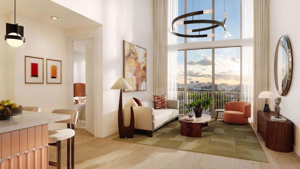 Modern living room with tall windows overlooking the city and a furnished balcony.