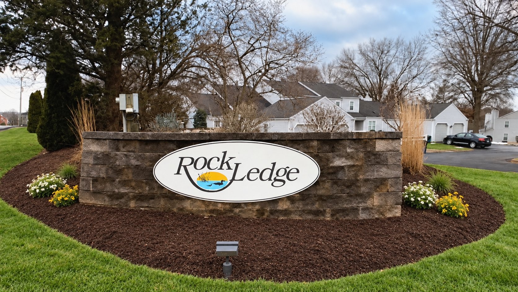 Rockledge entrance sign with green lawn