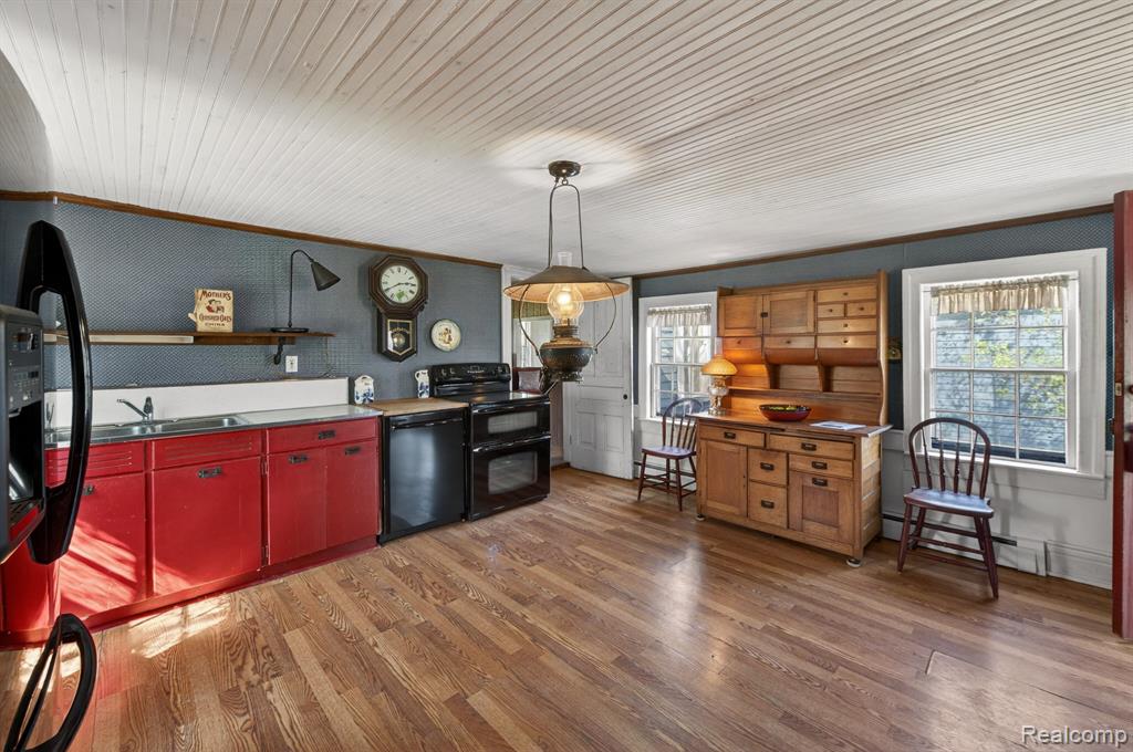Kitchen in the 4-bedroom home for sale at 13278 9 Mile Road, South Lyon, MI