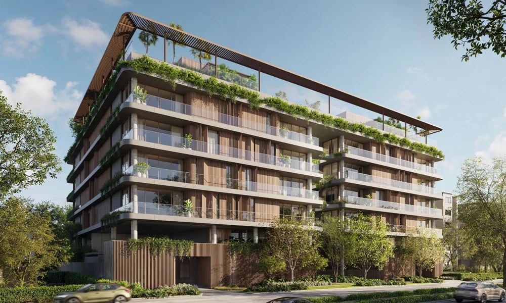 Contemporary condominium with glass balconies, planted terraces, and landscaped street frontage.