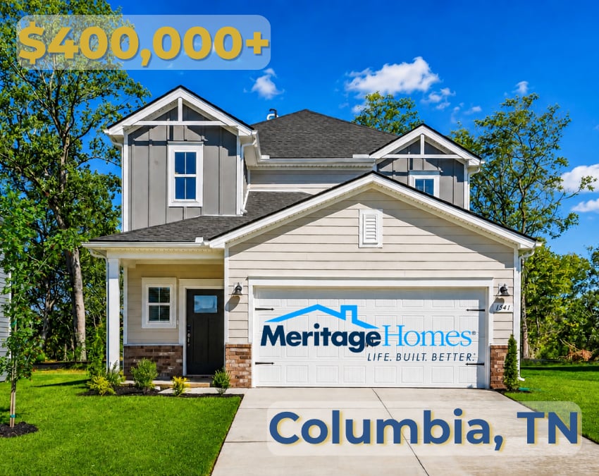 Two-story light-sided home in Columbia, Tennessee, with a double garage and landscaped lawn.