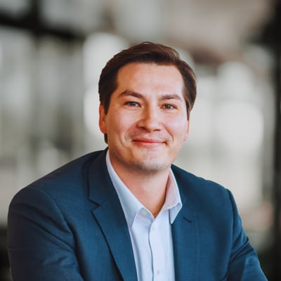 Connor Woods wearing a navy blazer and white shirt.