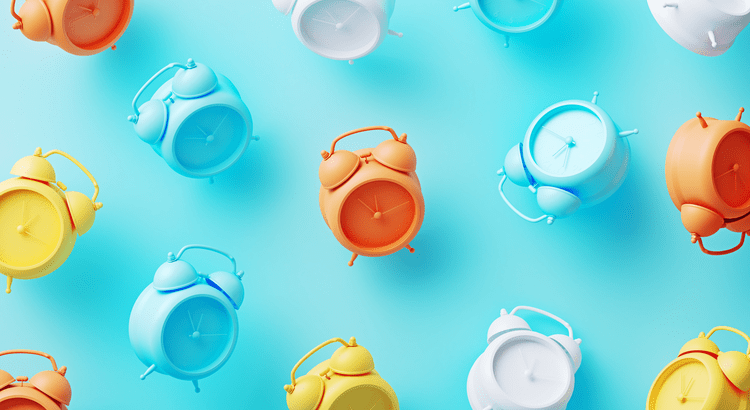 Colorful alarm clocks arranged on a blue background, showcasing a vibrant and playful design.