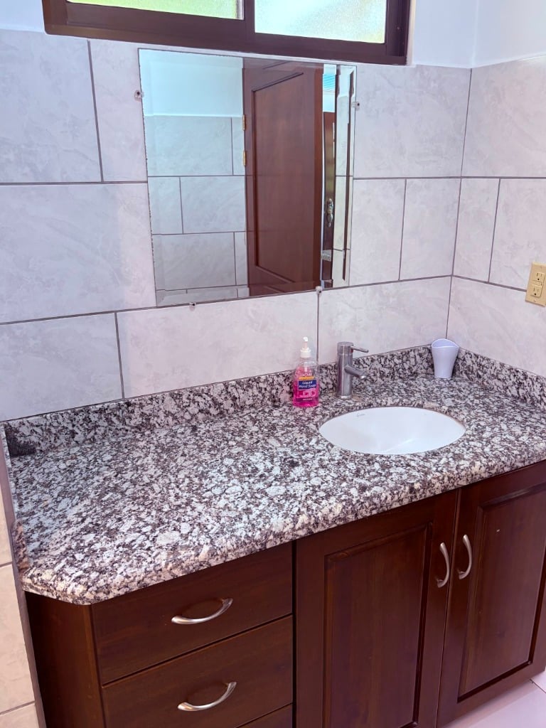 Move in ready 2 bedroom / 2 bathroom home with window ocean view and pool in Ojochal.