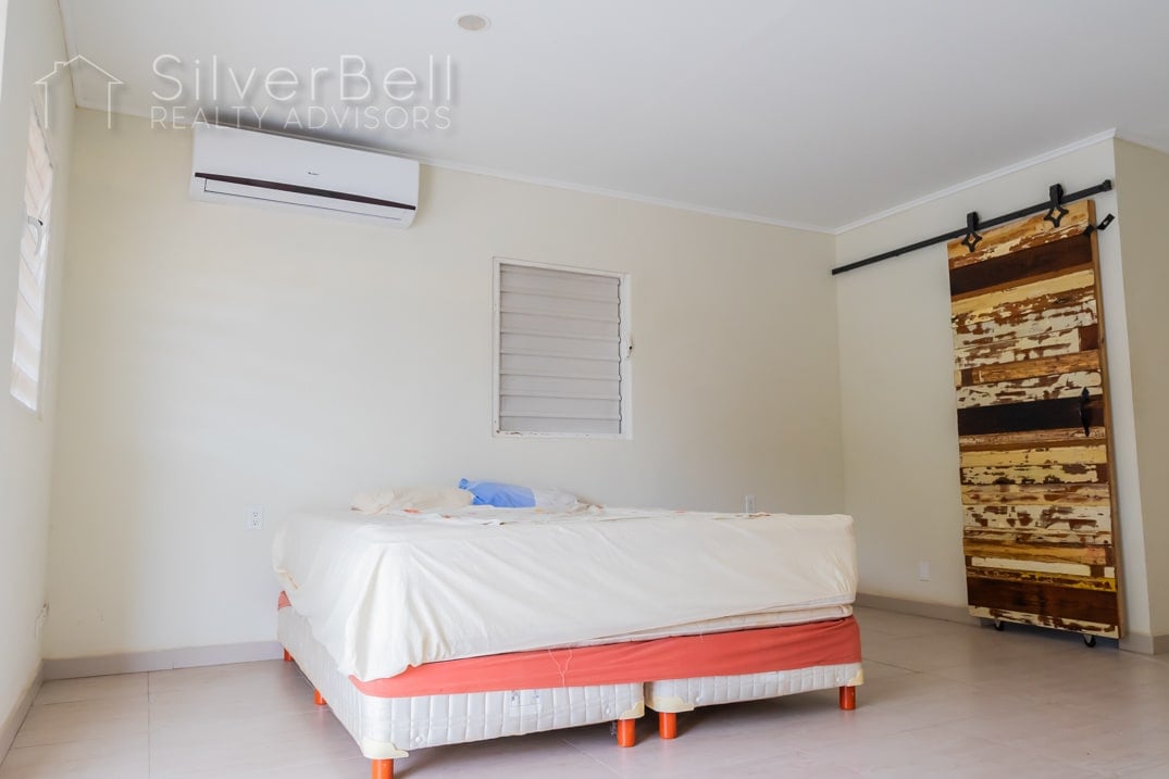 Welcome to this fully furnished apartment, located in Amandelweg, Dominguito, Curaçao where every bedroom is equipped with air conditioning and 5 minutes away from Mambo Beach. SilverBell Realty Advisors - Curaçao