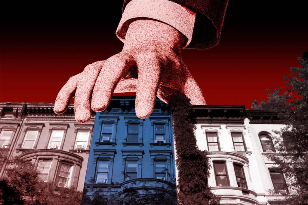 A giant hand selects a blue townhouse from a row of attached buildings.