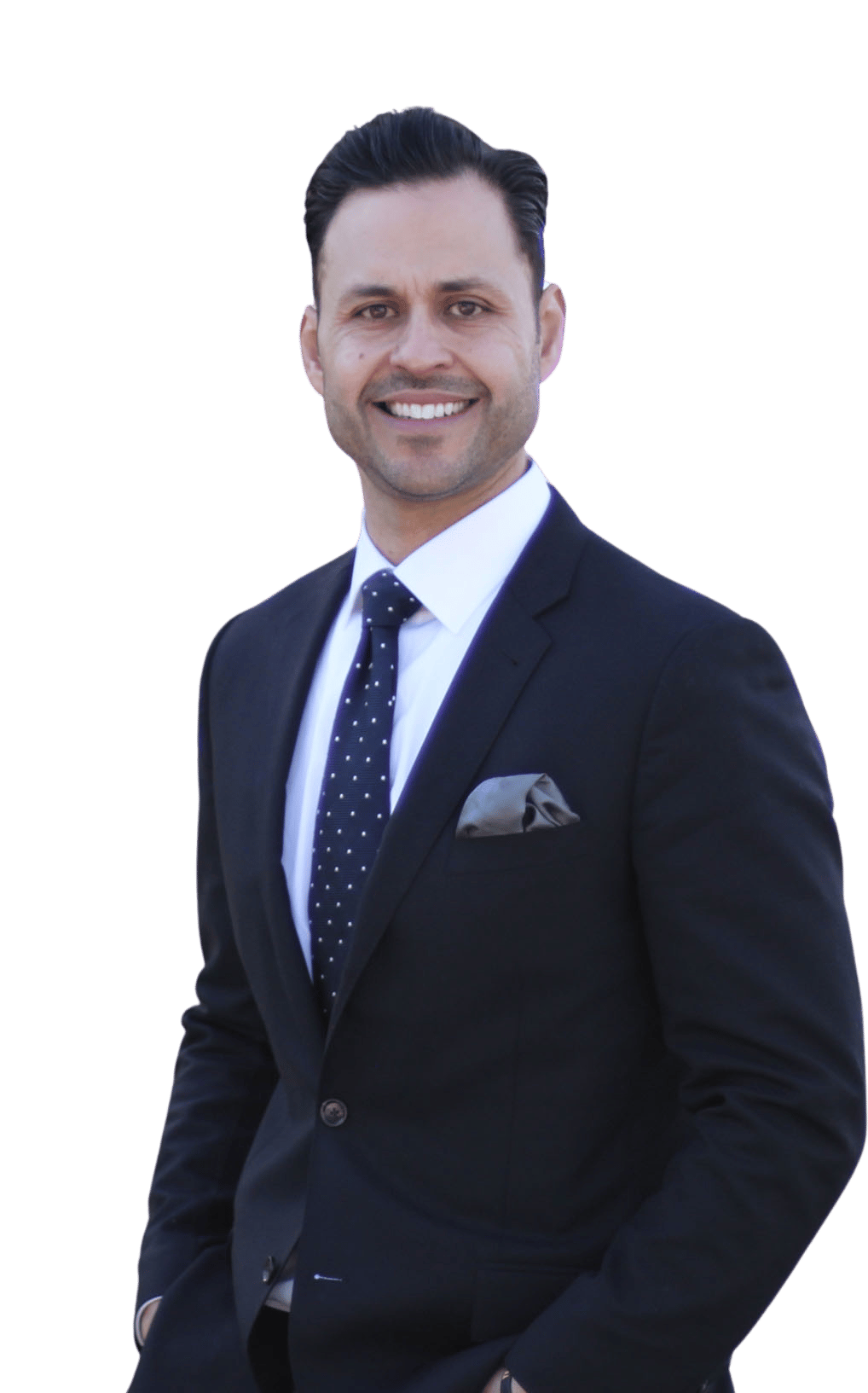 Armando Rangel in a dark suit and dotted tie