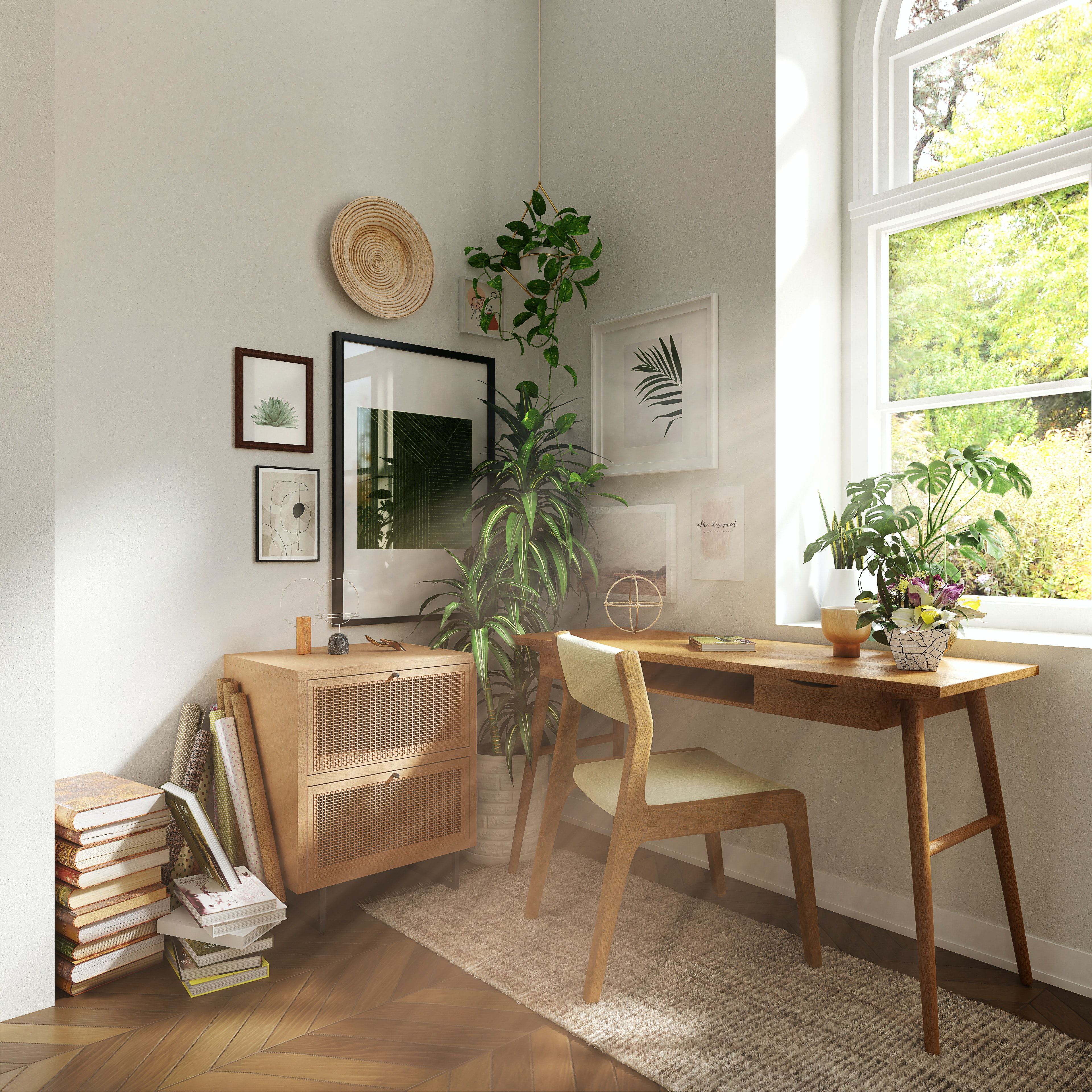 Sunlit home office with a wooden desk, arched window, leafy plants, and botanical wall art.