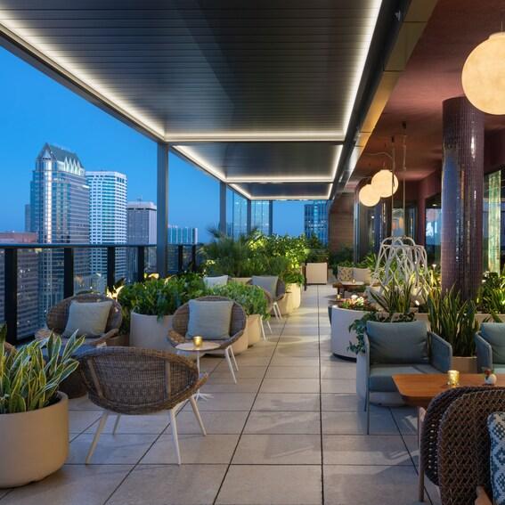 Rooftop restaurant overlooking the Tampa skyline at sunset.