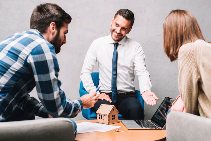 realtor meeting with his couple client