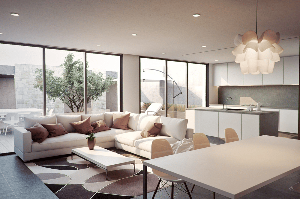 Modern open-plan living room with a white sectional, geometric rug, and large patio windows.
