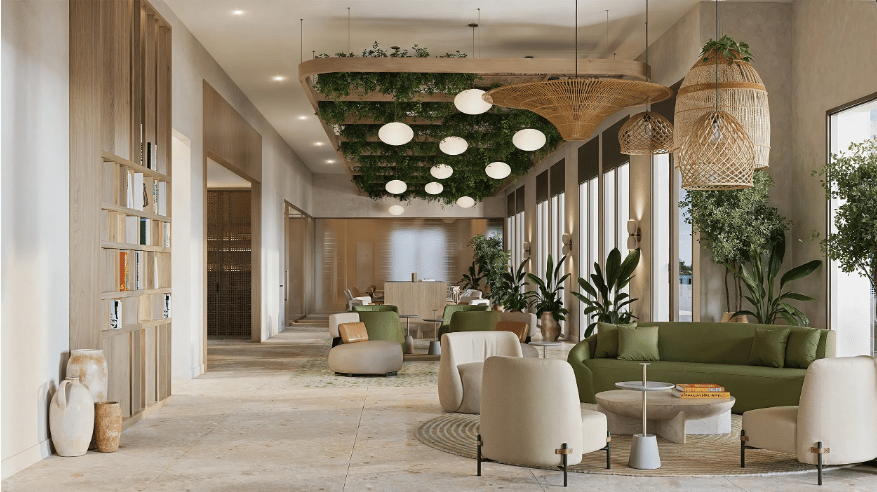 Condo lobby lounge with green sofas, indoor plants, and a ceiling feature covered in greenery.