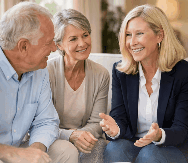 Real estate agent in Hickory NC discussing homes for sale in Catawba County NC with an older couple.