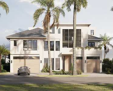 Modern white two-story home with tall windows, two garage doors, and palms along the street.