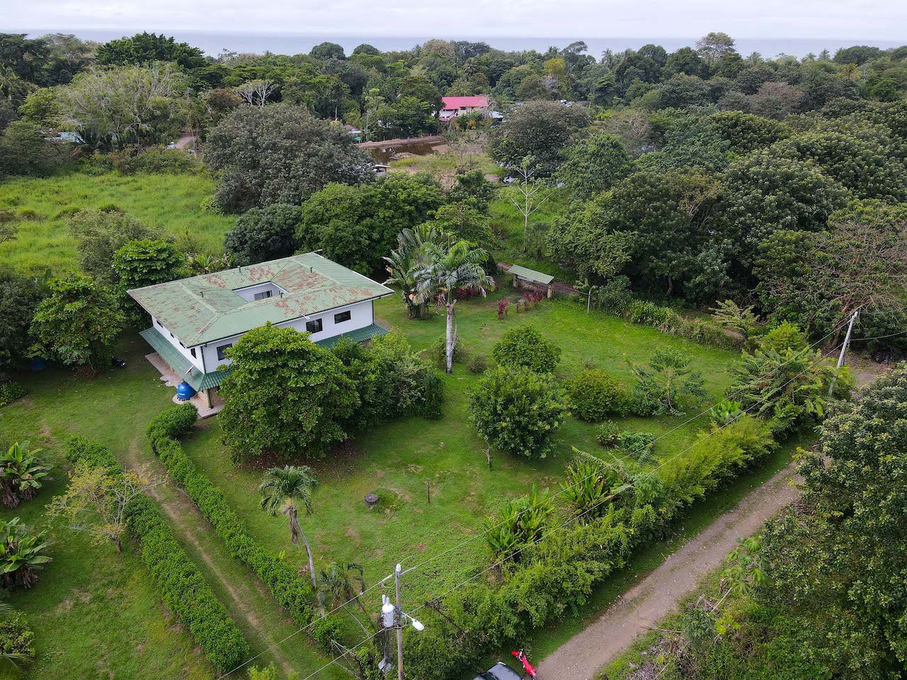 HOME AND APARTMENT WALKING DISTANCE TO THE BEACH – 1.3 ACRES