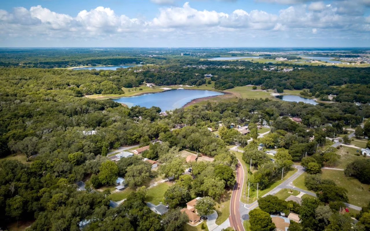 Charming streetscape of College Park in Orlando Florida featuring classic homes, tree-lined roads, and a vibrant local lifestyle