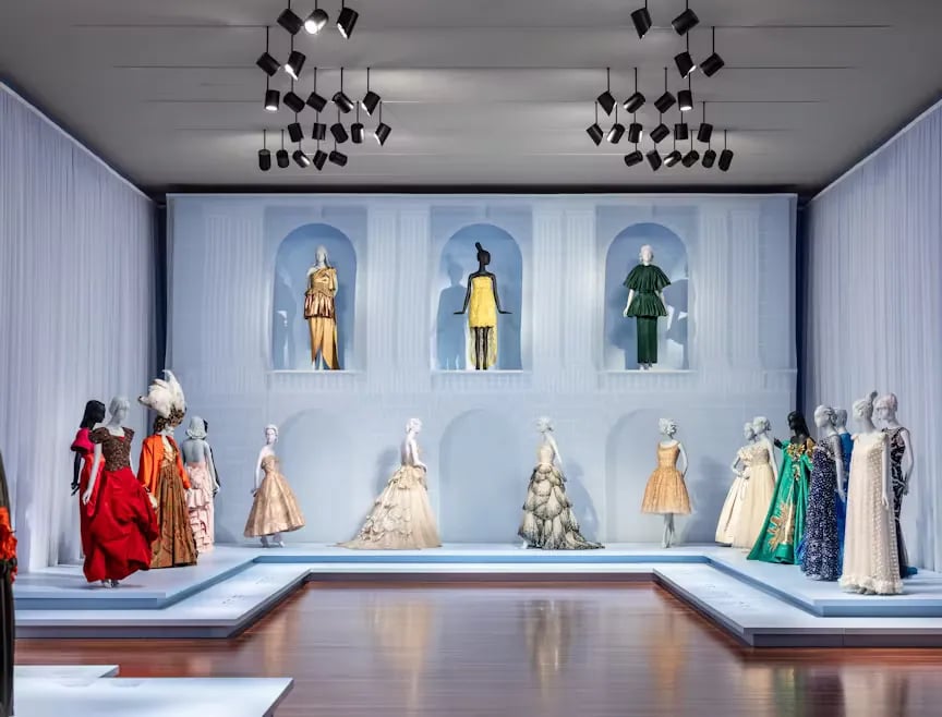 Display of historical textiles and costumes showing the diversity of materials, techniques, and cultural origins represented in the collection.