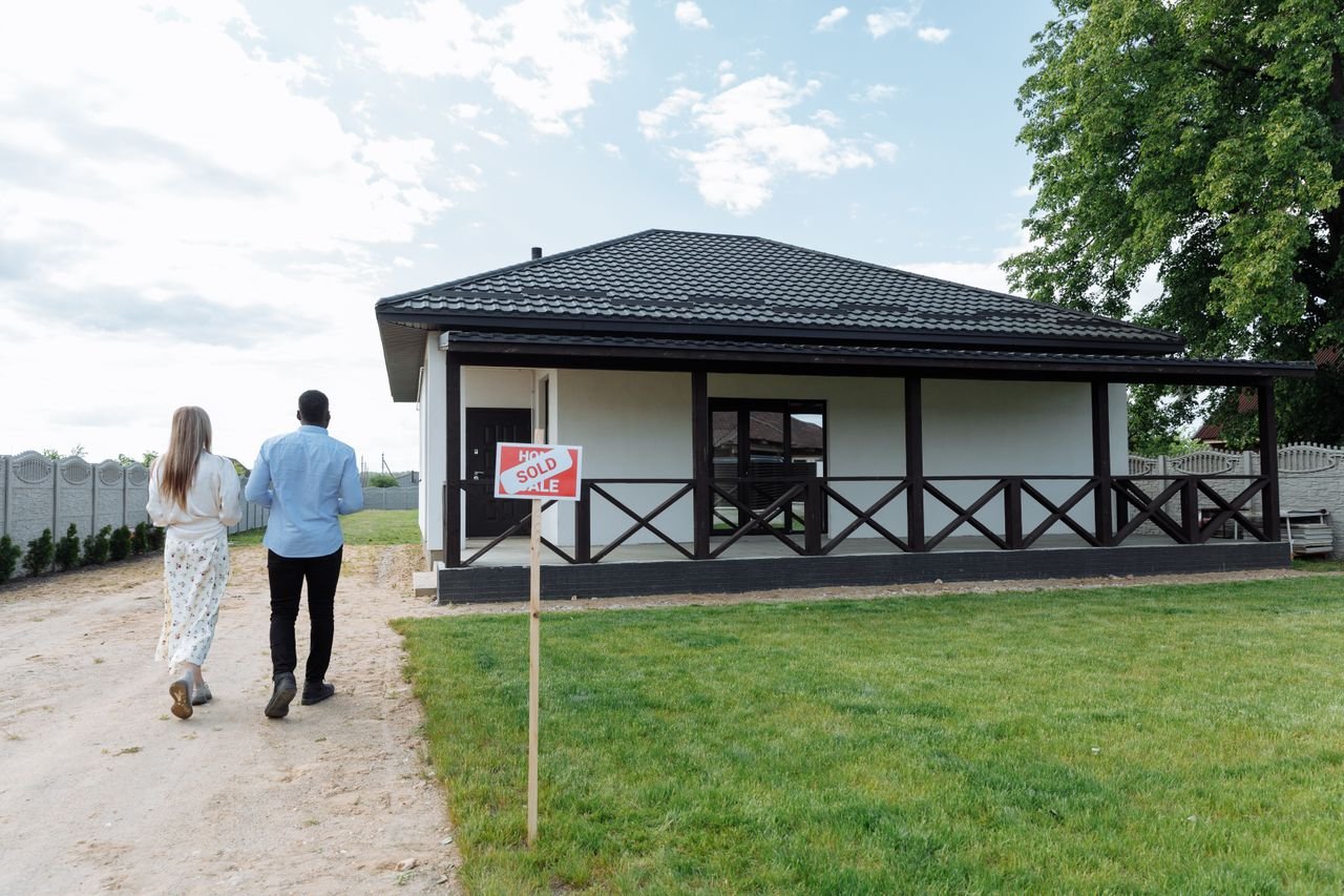 Couple walking toward their new home
