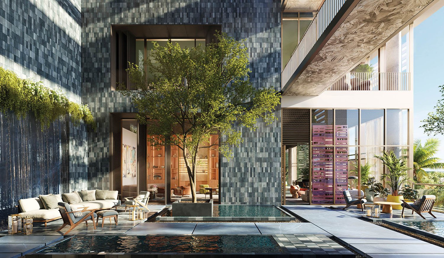 Condominium courtyard with reflecting pool, cascading water feature, and furnished outdoor lounge areas.