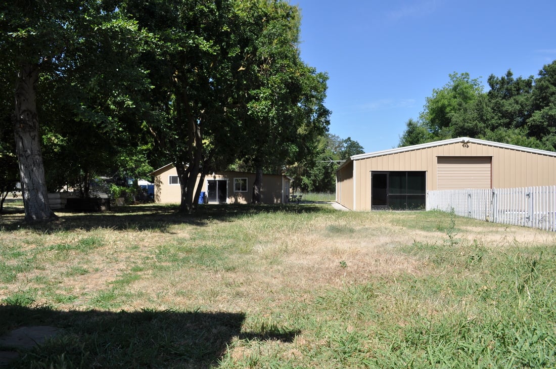 Large Lot, Spacious Home, and A Giant Workshop! Unique Opportunity.