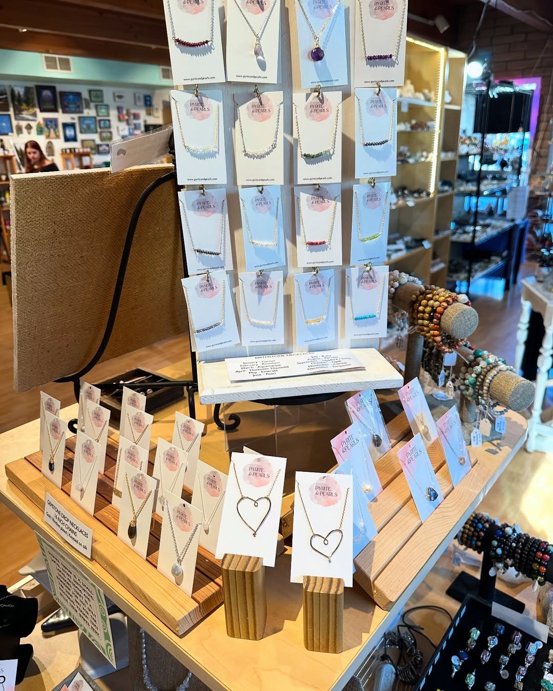 Handmade jewelry including necklaces, earrings, and bracelets with natural stones, perfect for gifts