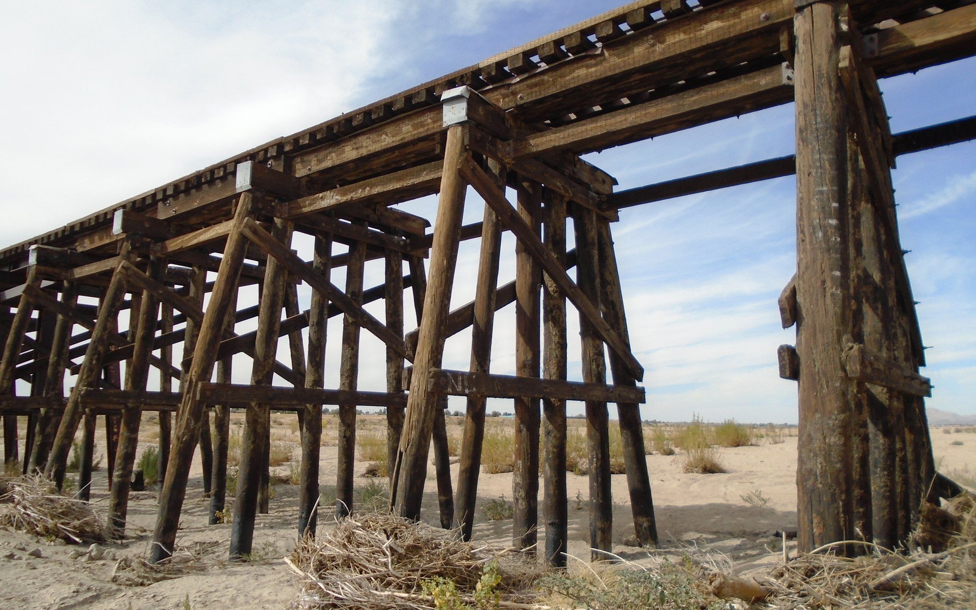 Wooden train trestle over the Mojave River at Rock Springs Road in Apple Valley, photographed in 2019