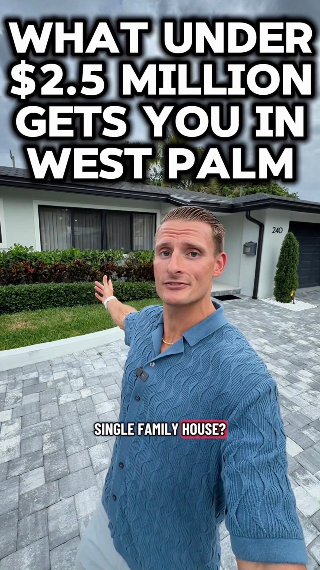 Single-story West Palm Beach home with a landscaped front yard and wide paver driveway.