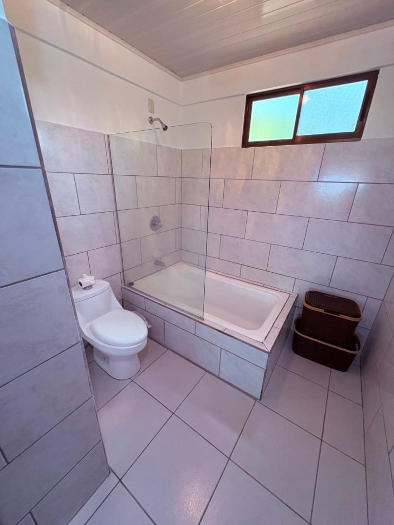 Move in ready 2 bedroom / 2 bathroom home with window ocean view and pool in Ojochal.