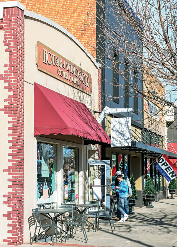 House of Windsor Coffee & Cafe storefront with a red awning and sidewalk seating.