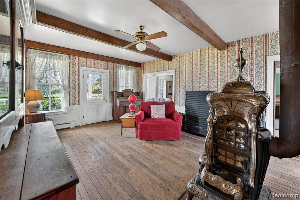 Living area in the 4-bedroom home for sale at 13278 9 Mile Road, South Lyon, MI,