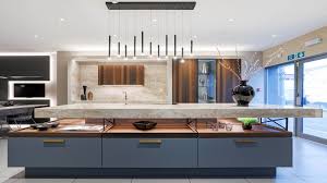 A modern luxury kitchen with a marble waterfall island and seamless indoor-outdoor flow in a custom home at The Summit, El Dorado Hills.