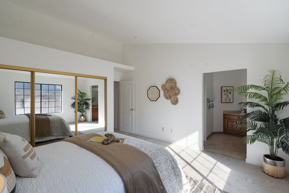Primary bedroom suite with en suite bath and double vanity in Petaluma home
