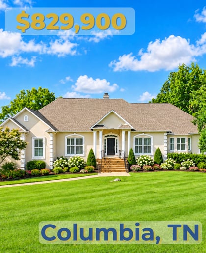 Single-story Columbia home with a broad front porch, landscaped flower beds, and a neatly striped lawn.