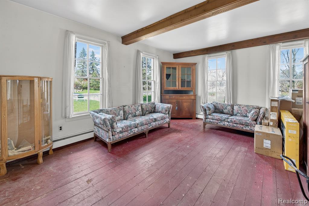 Living area in the 4-bedroom home for sale at 13278 9 Mile Road, South Lyon, MI,