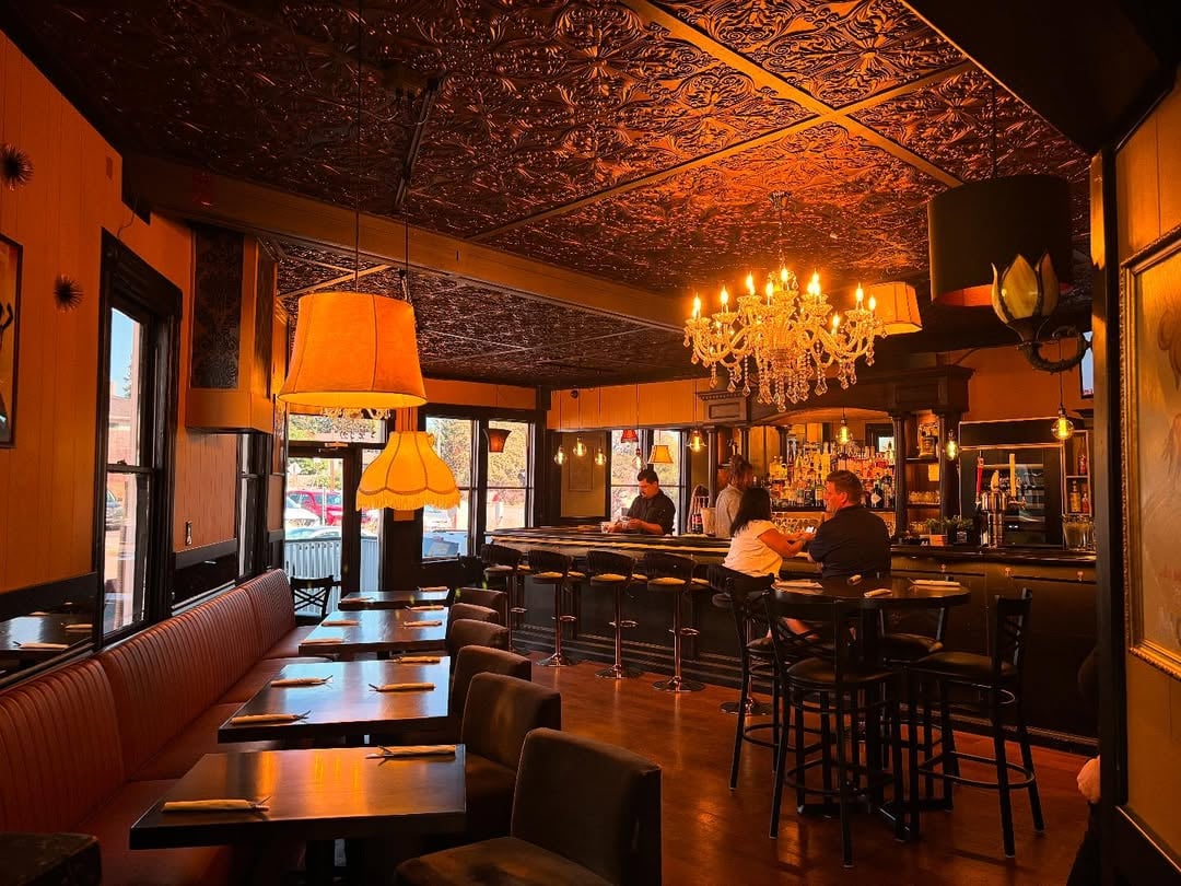 Guests enjoying happy hour food and cocktails at The Grove Speakeasy in Penngrove