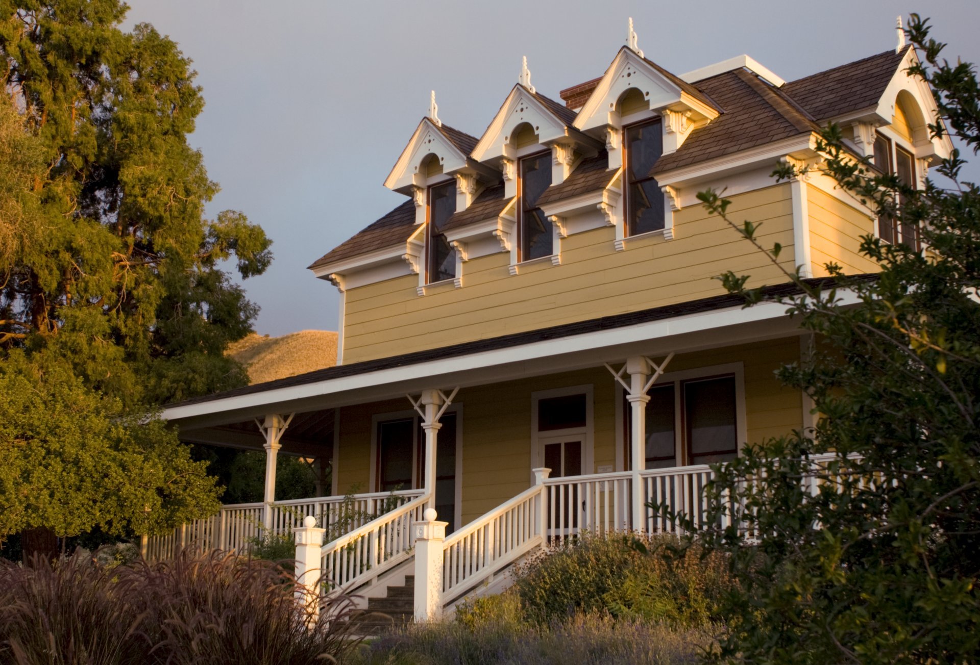 Historic Gilman Ranch house in Banning with porch and surrounding vegetation