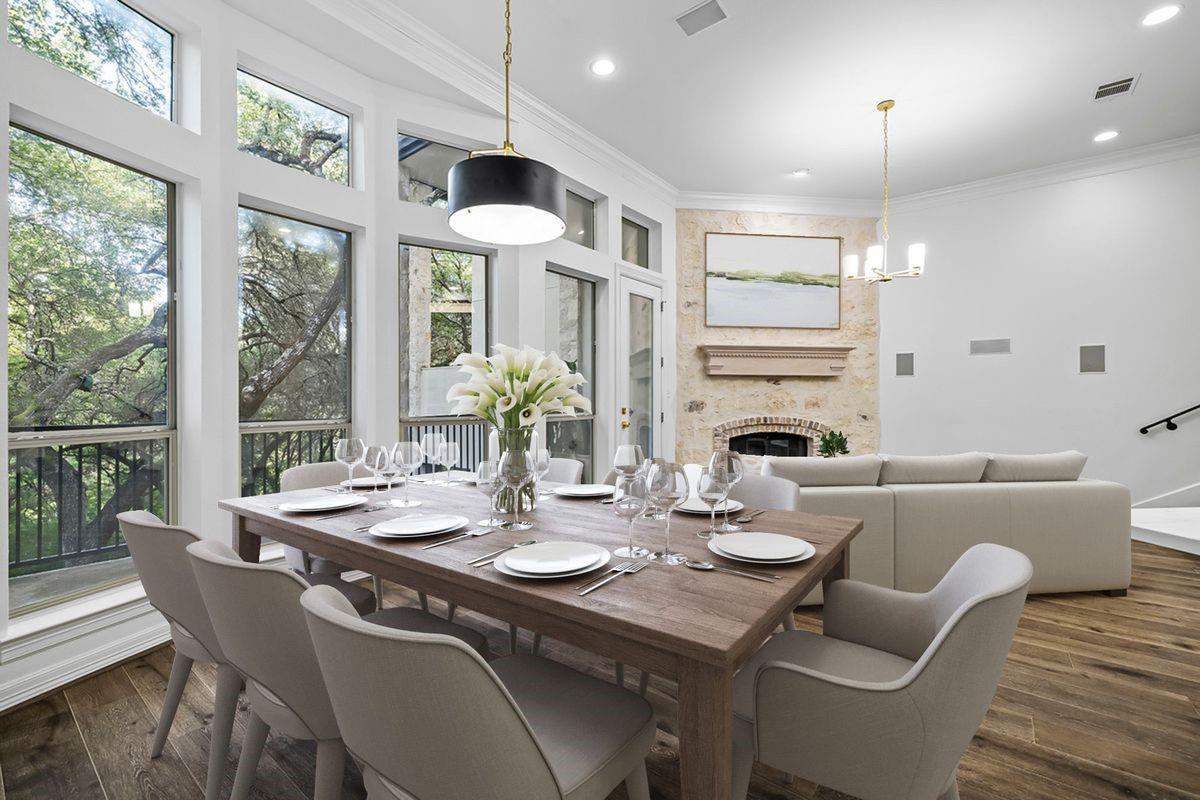 Dining room with floor-to-ceiling windows overlooking the greenbelt, Barton Hollow, Spyglass Drive, Westlake, Austin.