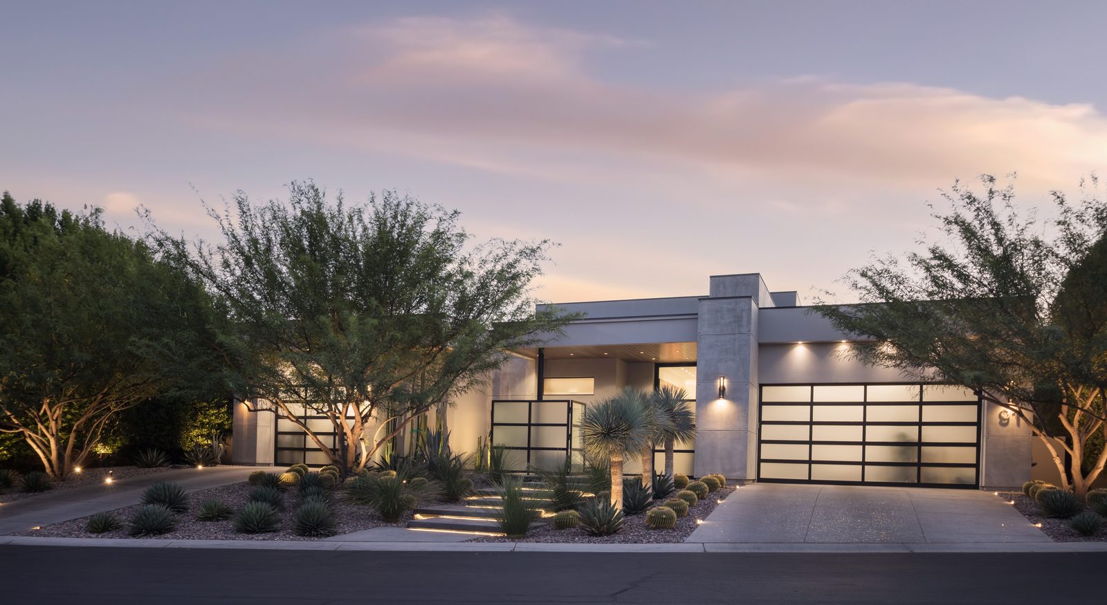 Single-story modern home in The Ridges at twilight