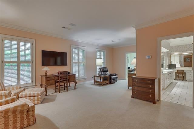 Furnished living area with shuttered windows, a television, and a desk beside an open bathroom doorway.