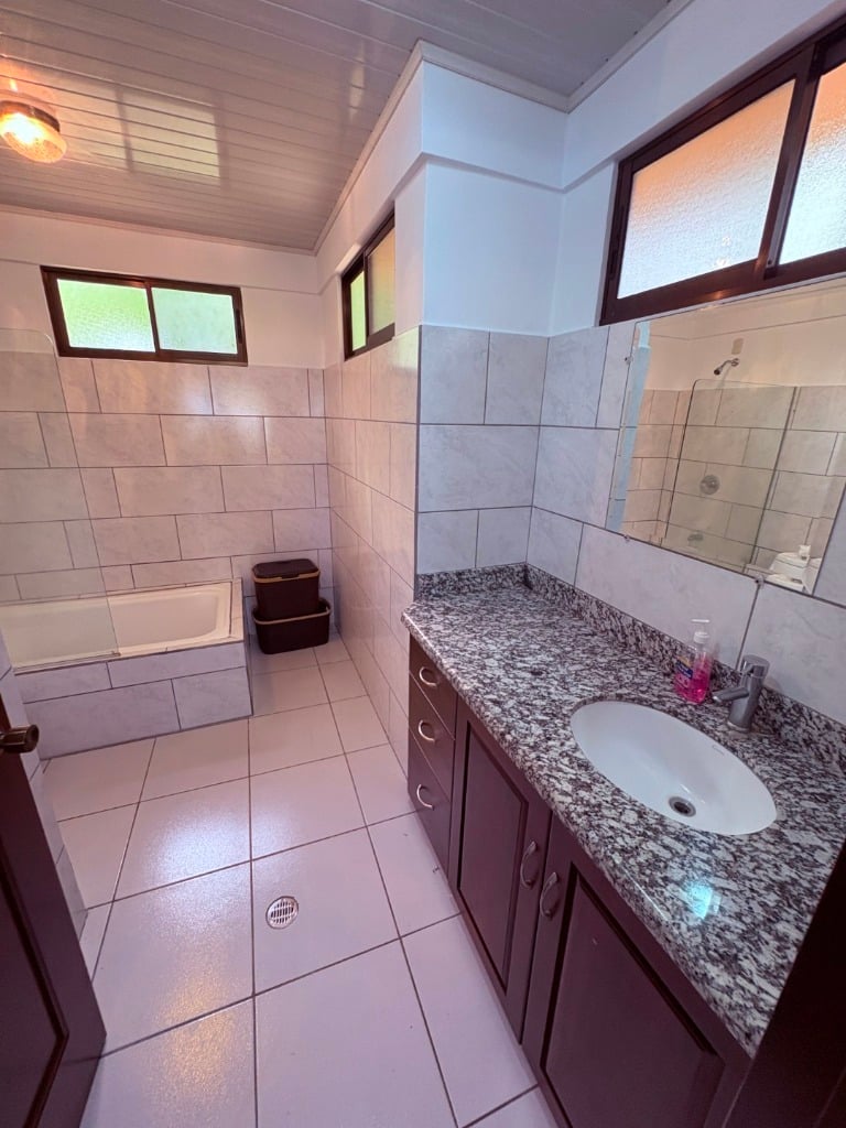 Move in ready 2 bedroom / 2 bathroom home with window ocean view and pool in Ojochal.