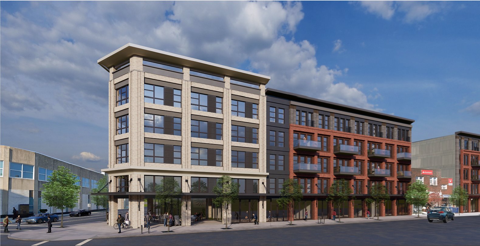 Modern mixed-use building with apartments, storefronts, balconies, and a long street-facing facade.