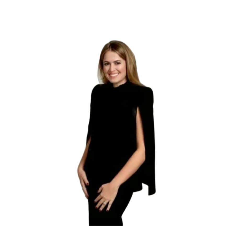 Blanca Lopez smiling in a black outfit against a white background.
