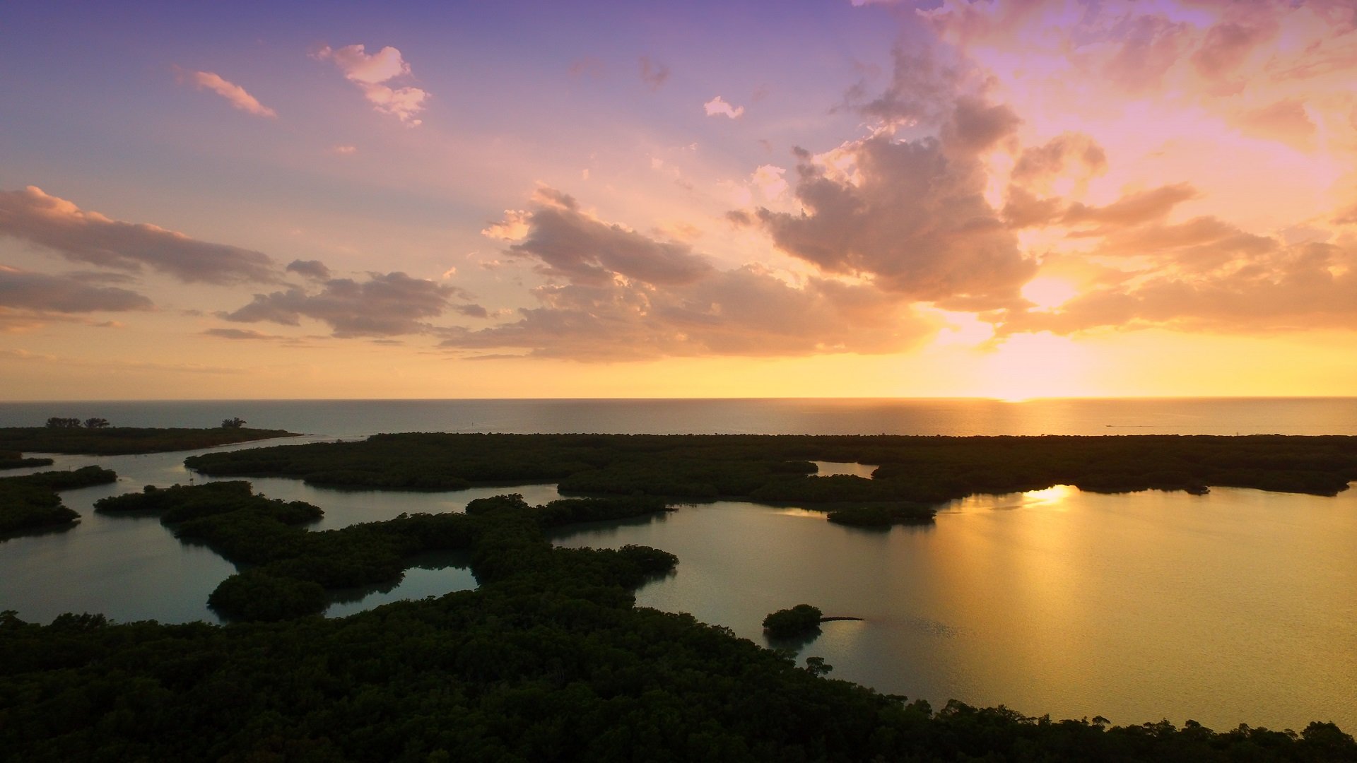 Sunset over the mangrove estuary and the Gulf of Mexico from Kalea Bay in North Naples