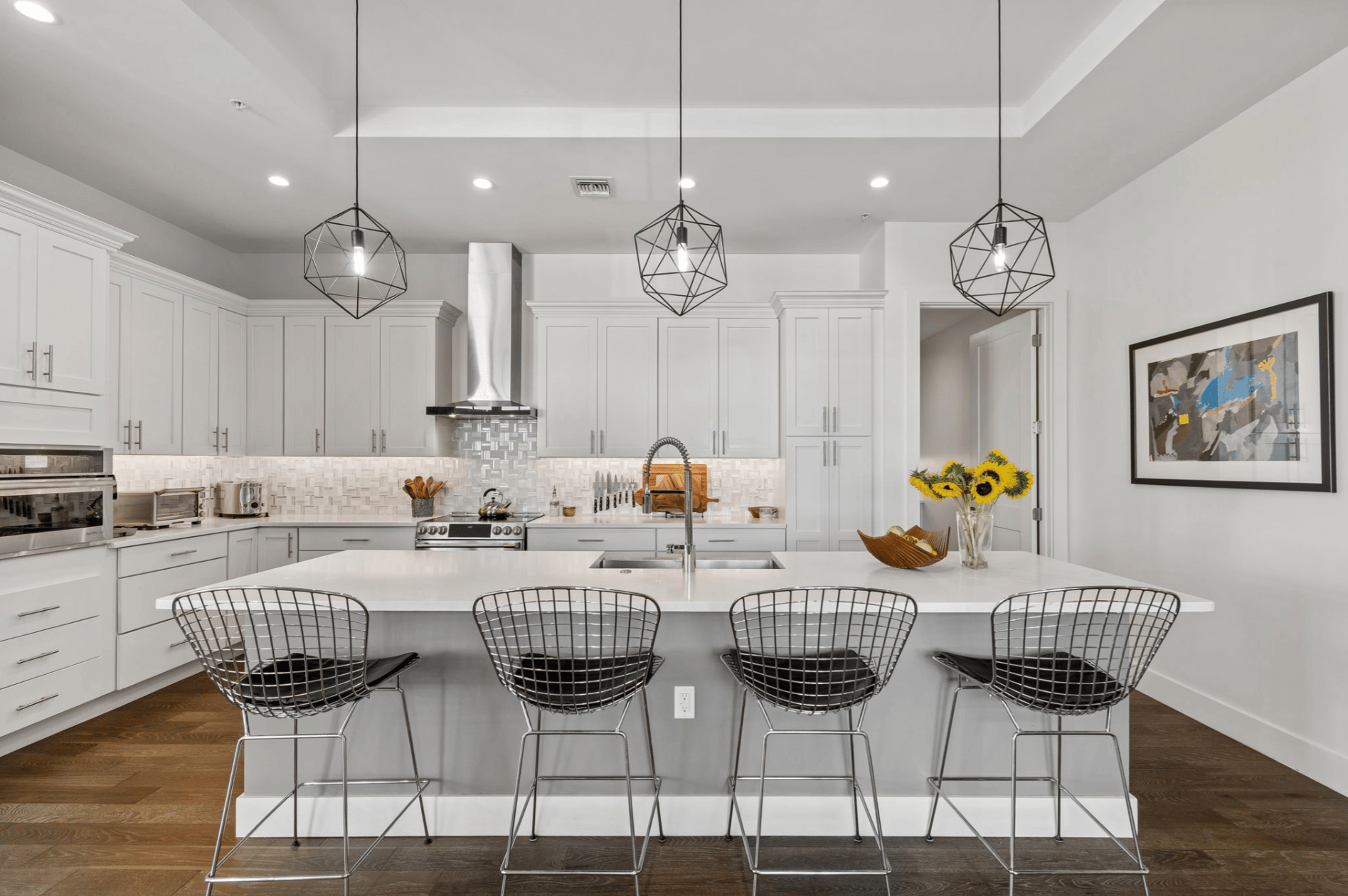Kitchen with large island and wire counter stools in a Davis Islands condo in Tampa