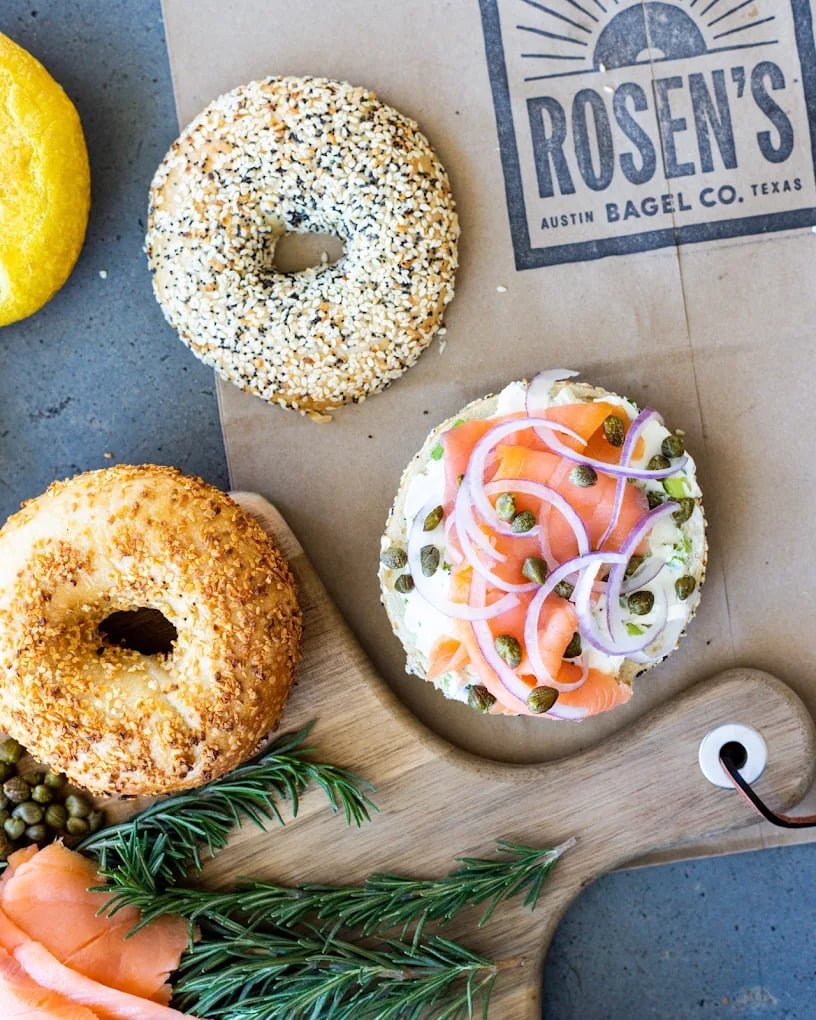 Bagels from Rosen's, including one topped with smoked salmon, red onion, capers, and cream cheese.