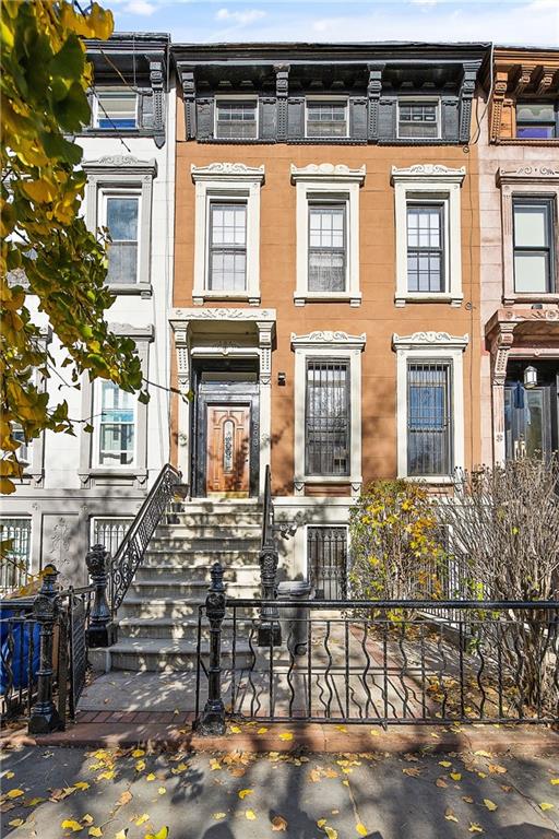 3-family brownstone townhouse at 593 Madison St Bedford-Stuyvesant Brooklyn sold by The Parviz Team at Compass.