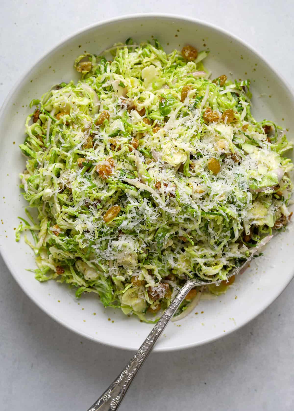 A Perfect Winter Salad: Brussels Sprout Ribbons with Pecorino, Walnuts, and Golden Raisins