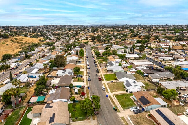 Aerial view of Jamacha in Southeast San Diego showing single-story homes, wide streets, and hillside surroundings—highlighting the neighborhood's real estate value and suburban layout.